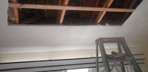 Water Damage Restoration On Ceiling In Progress