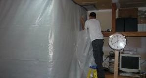 Water Damage Restoration Pro Sealing In Mold With A Vapor Barrier